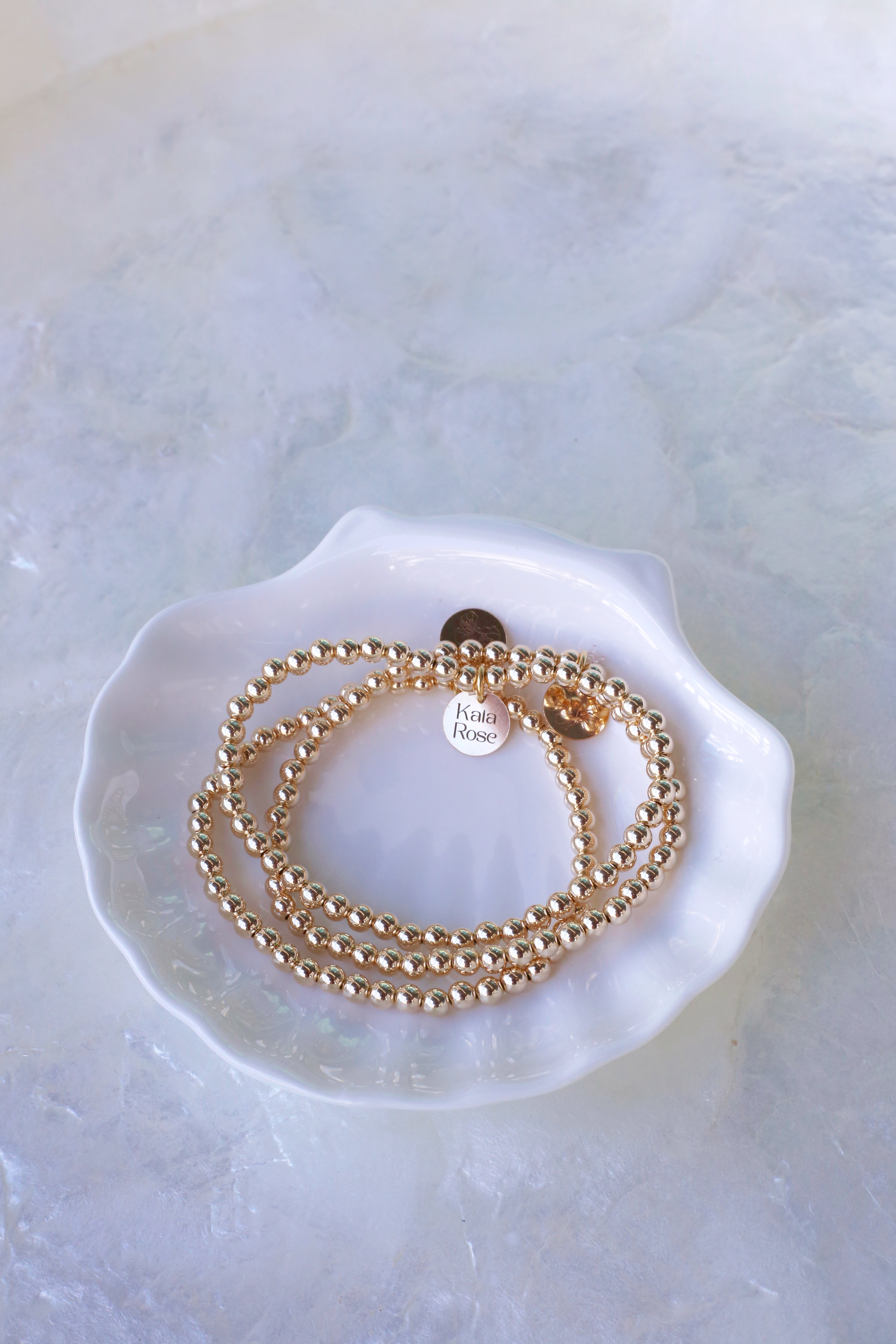 Goldie Set 14K Gold Filled Bead Bracelet Set of 3 on Shell Dish
