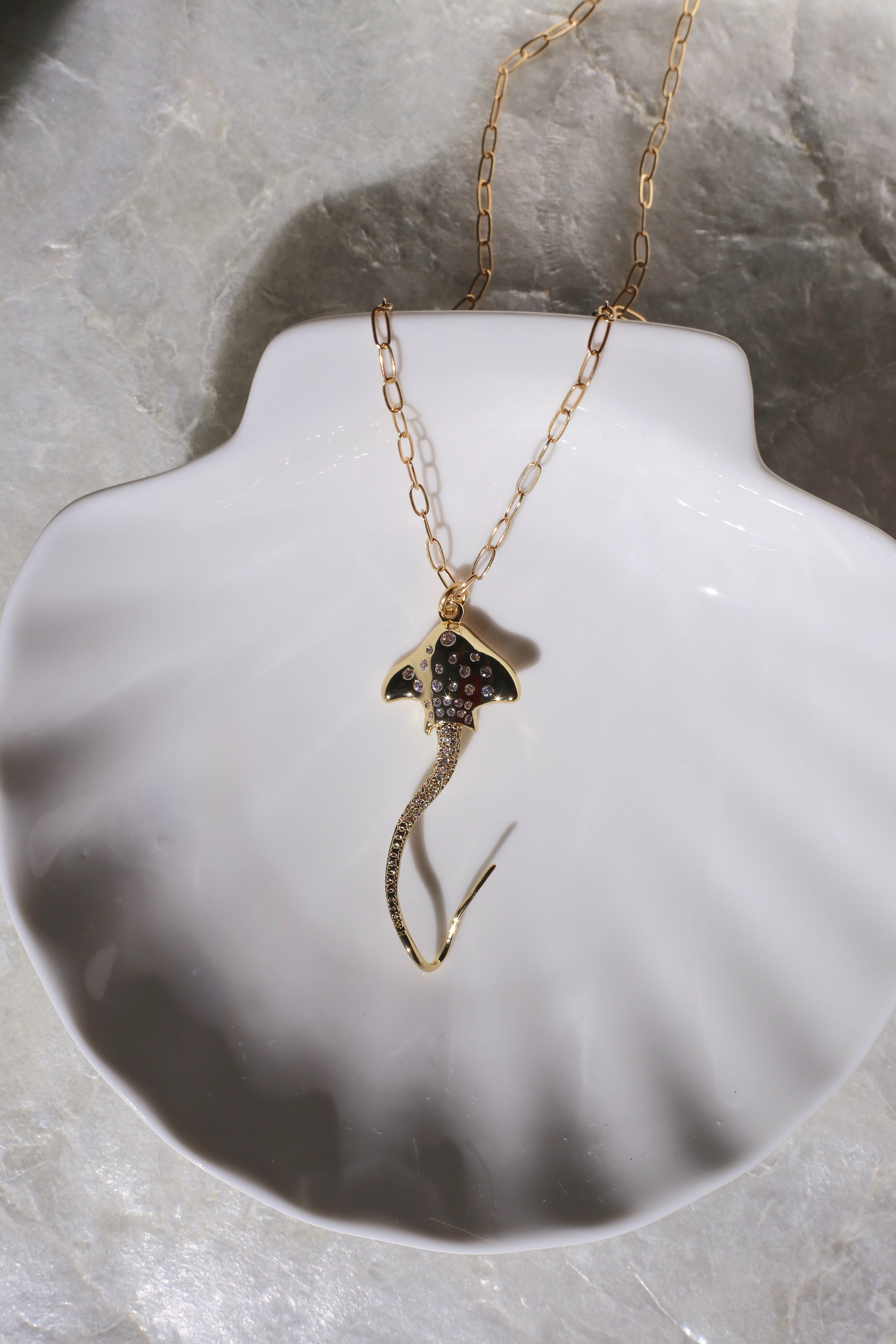 Hihimanu Spotted Eagle Ray Gold Charm Necklace on a Shell Plate