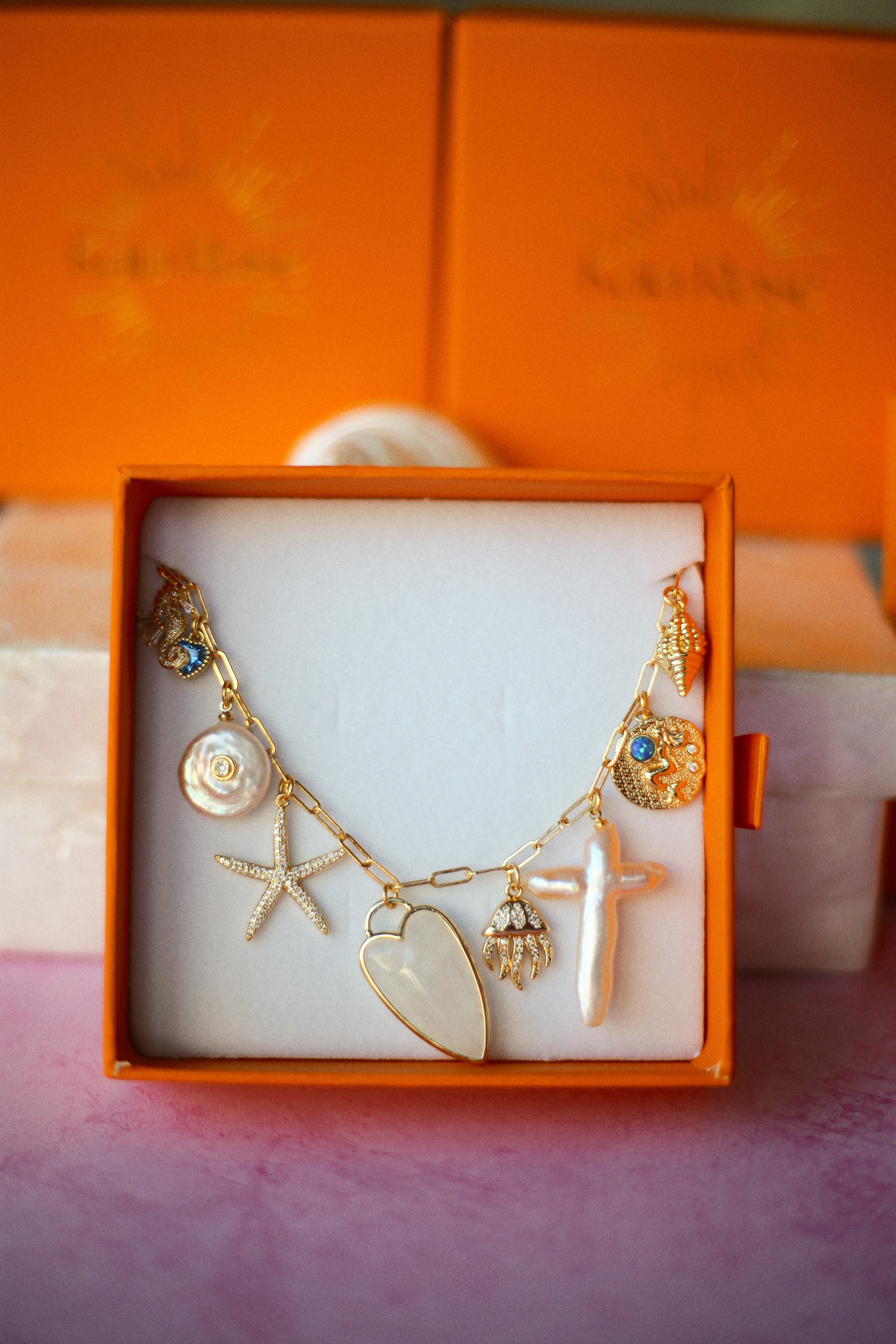 How to Build a Custom Charm Necklace That Tells Your Story