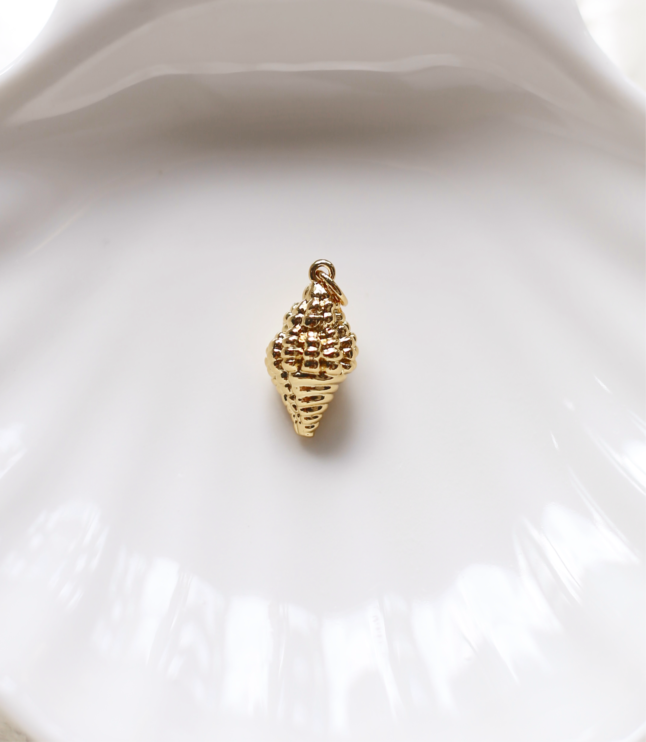 Small gold conch shell