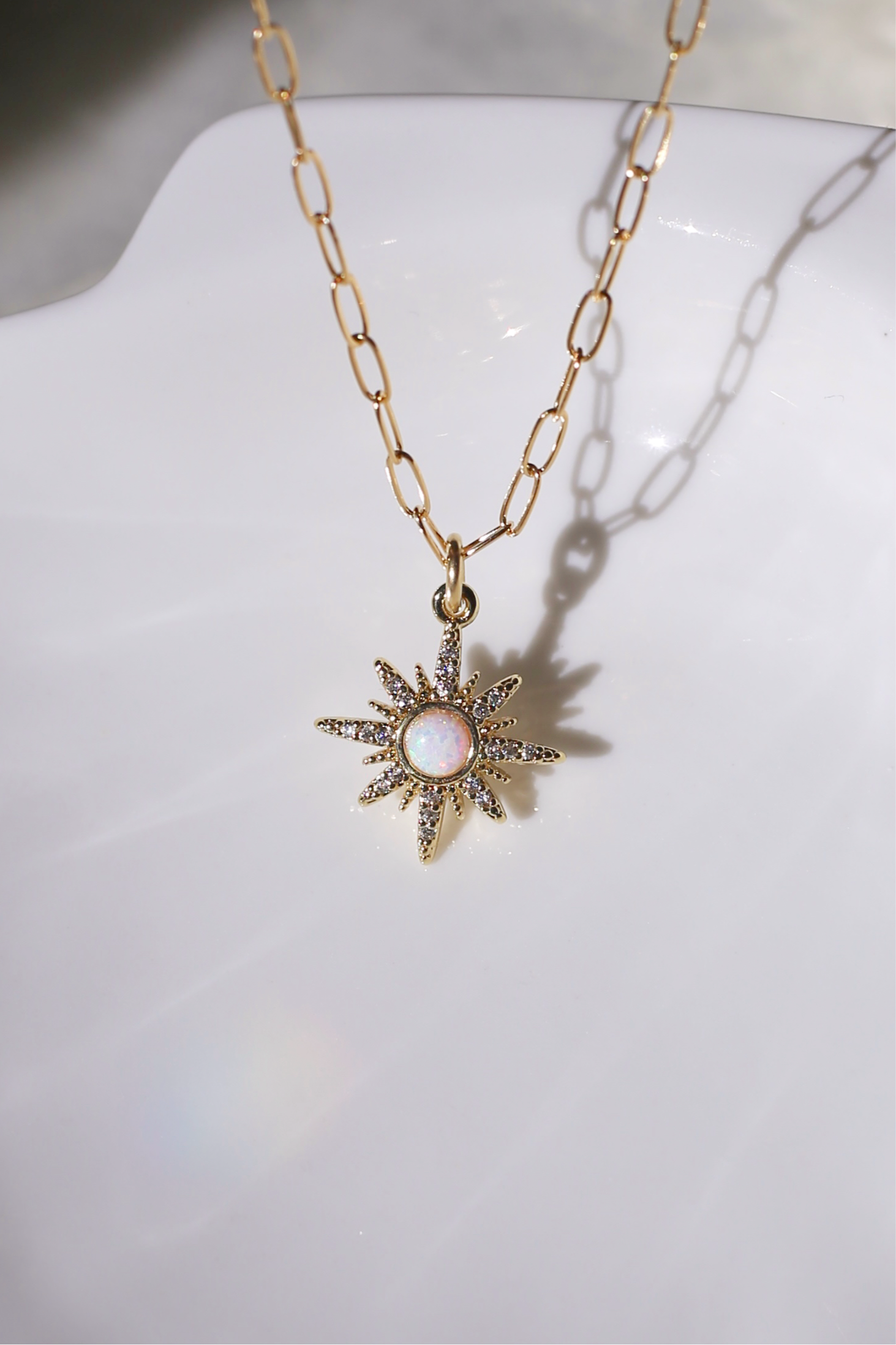 Gilly Gold with Opal Center Starburst Charm Close Up