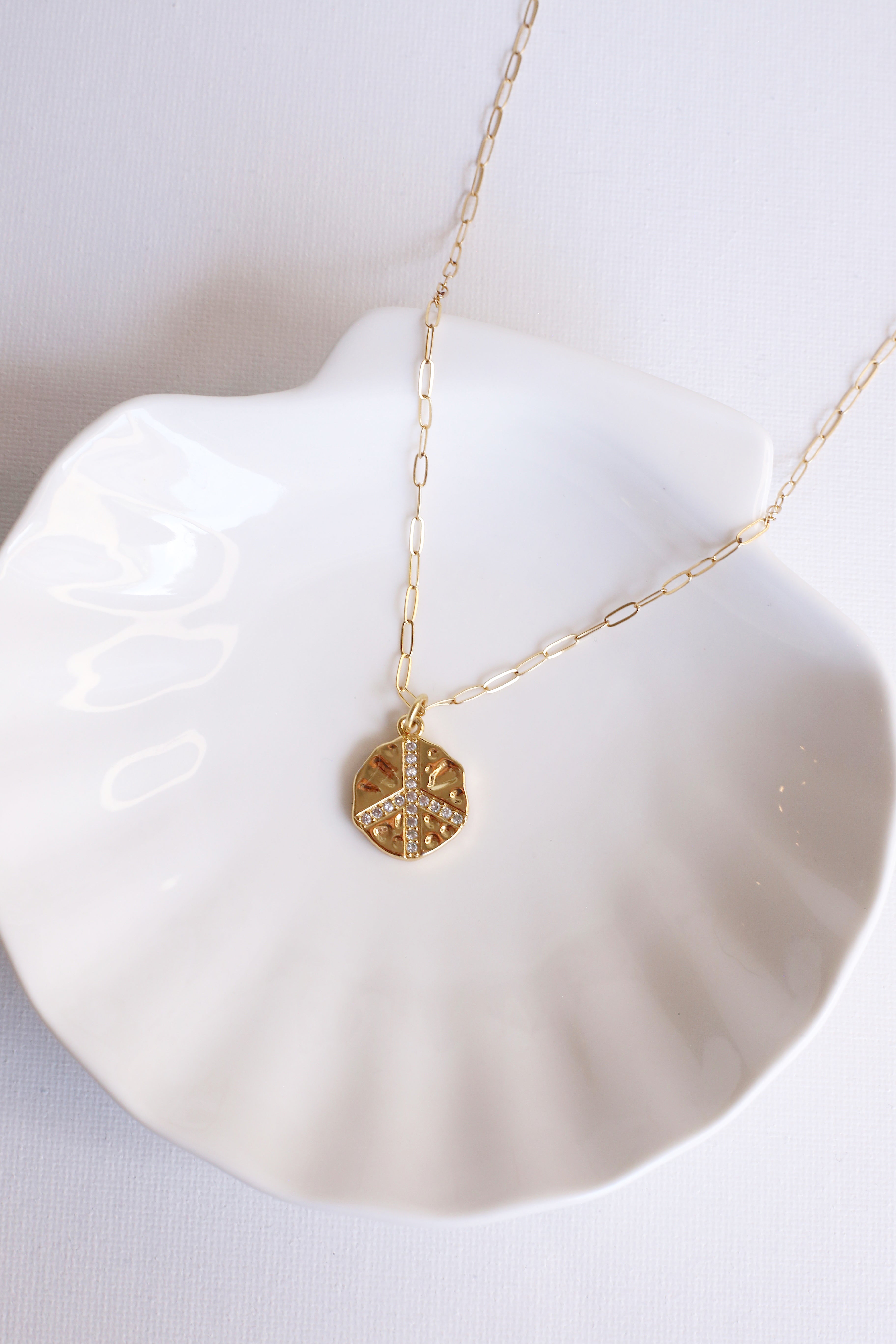Gold Peace Sign Charm Necklace On Shell