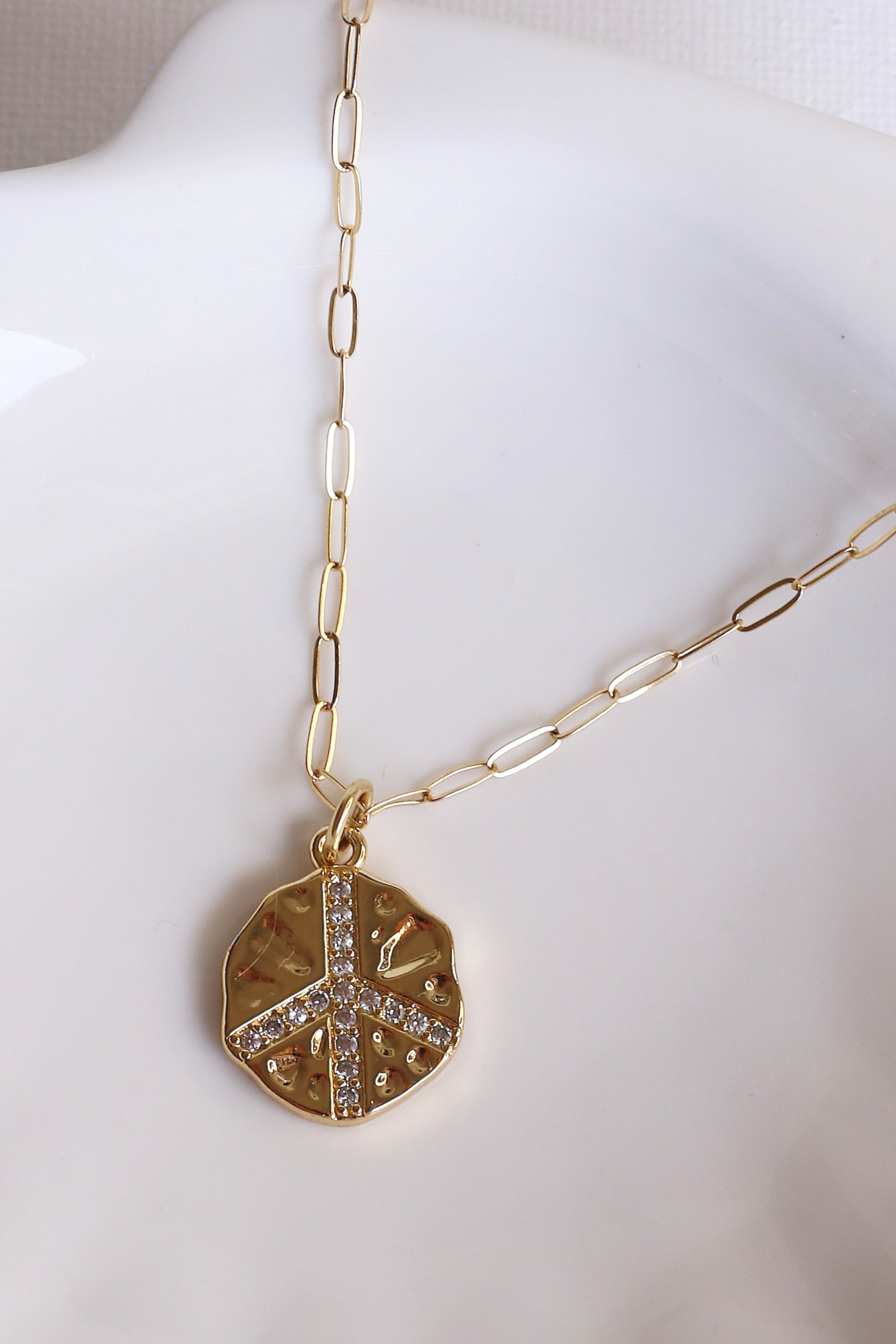 Gold Peace Sign Charm Necklace Up Close