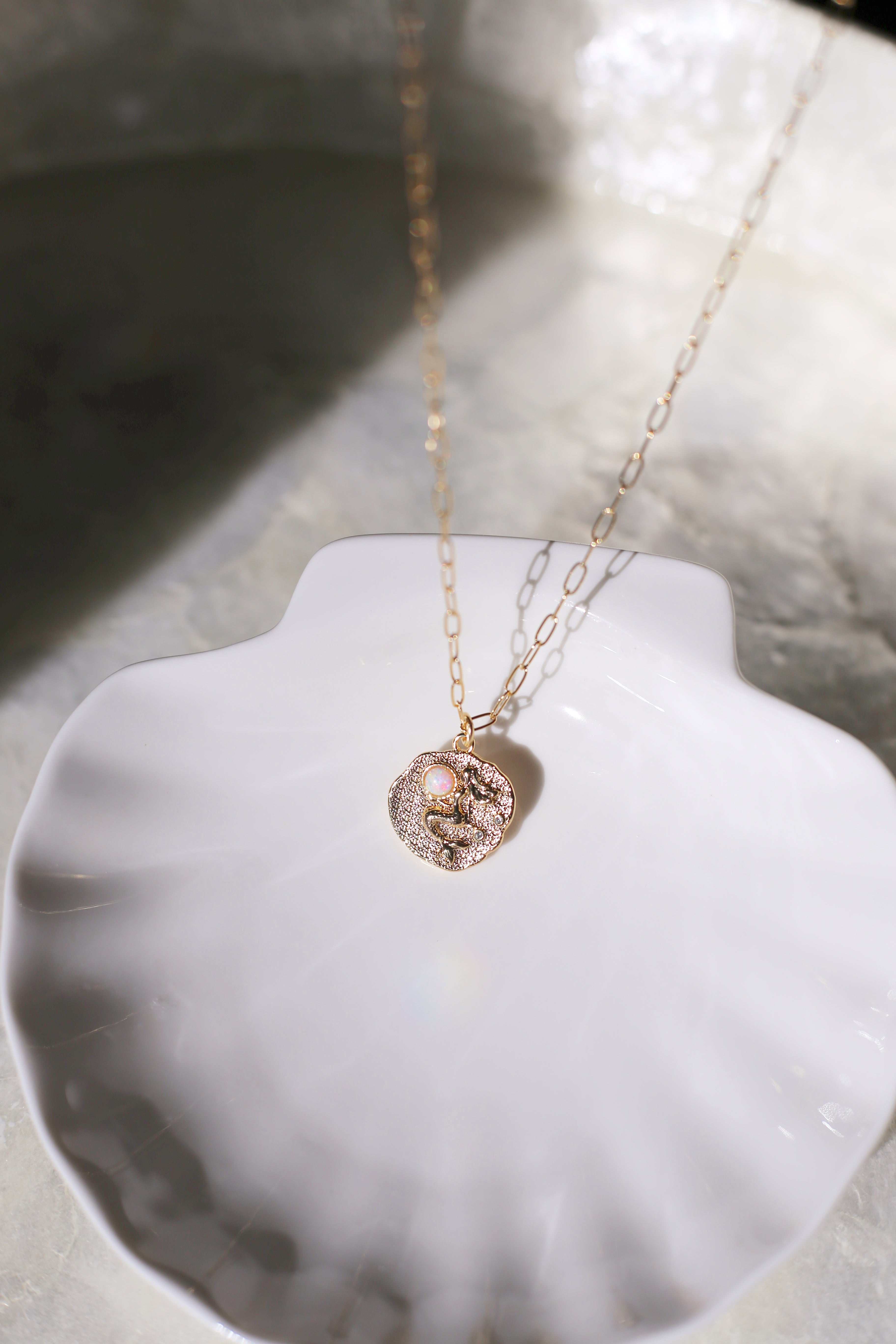 Sirena Gold with White Opal Charm Necklace Bokeh